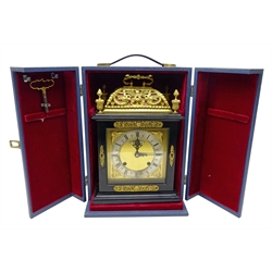  `The Golden Jubilee Clock` a William and Mary style ebonised  basket top table clock by F.W. Elliott, Croydon distributed by Garrard of London, pierced brass basket top with urn finials, signed brass dial with silvered Roman chapter, twin train movement striking the quarter hours on two gongs, Ltd.ed. 15/1000, in red velvet lined fitted case with keys, certificate and letters, H36cm, W23cm, D14cm   