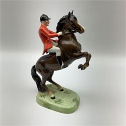 A Beswick model of a huntsman on rearing horse, model no 868 2nd edition, with printed mark beneath, H25cm. 