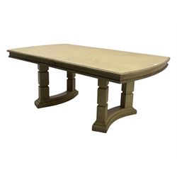 Brunswick - washed oak finish extending dining table, rectangular top with curved ends and carved frieze, central extension leaf, raised on twin pedestals with arched plinth bases and square-sectioned column supports; set of eight (6+2) high-back dining chairs upholstered in beige velvet fabric