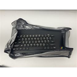 Sinclair ZX Spectrum (1984) with accessories and games; ten games for Sinclair Spectrum and 48K Spectrum to include ‘Knight Lore’, ‘The Way of the Exploding Fist’, and ‘Green Beret’ all in original boxes, ‘Rambo First Blood Part II’ without original box; Sinclair UK1400 Power Supply Unit, Hales Universal Mains Adapter, RAM Turbo Spectrum Joystick Interface, Starlite Cassette Player, all without boxes