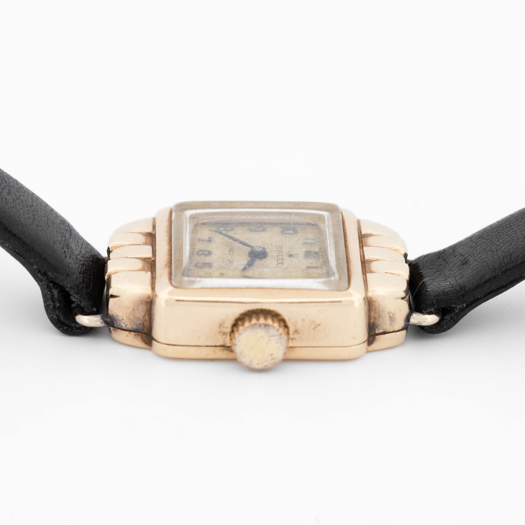 Rolex Precision ladies 9ct gold manual wind wristwatch, case No. 297900, silvered dial with Arabic hour markers, Chester 1955, on black leather strap