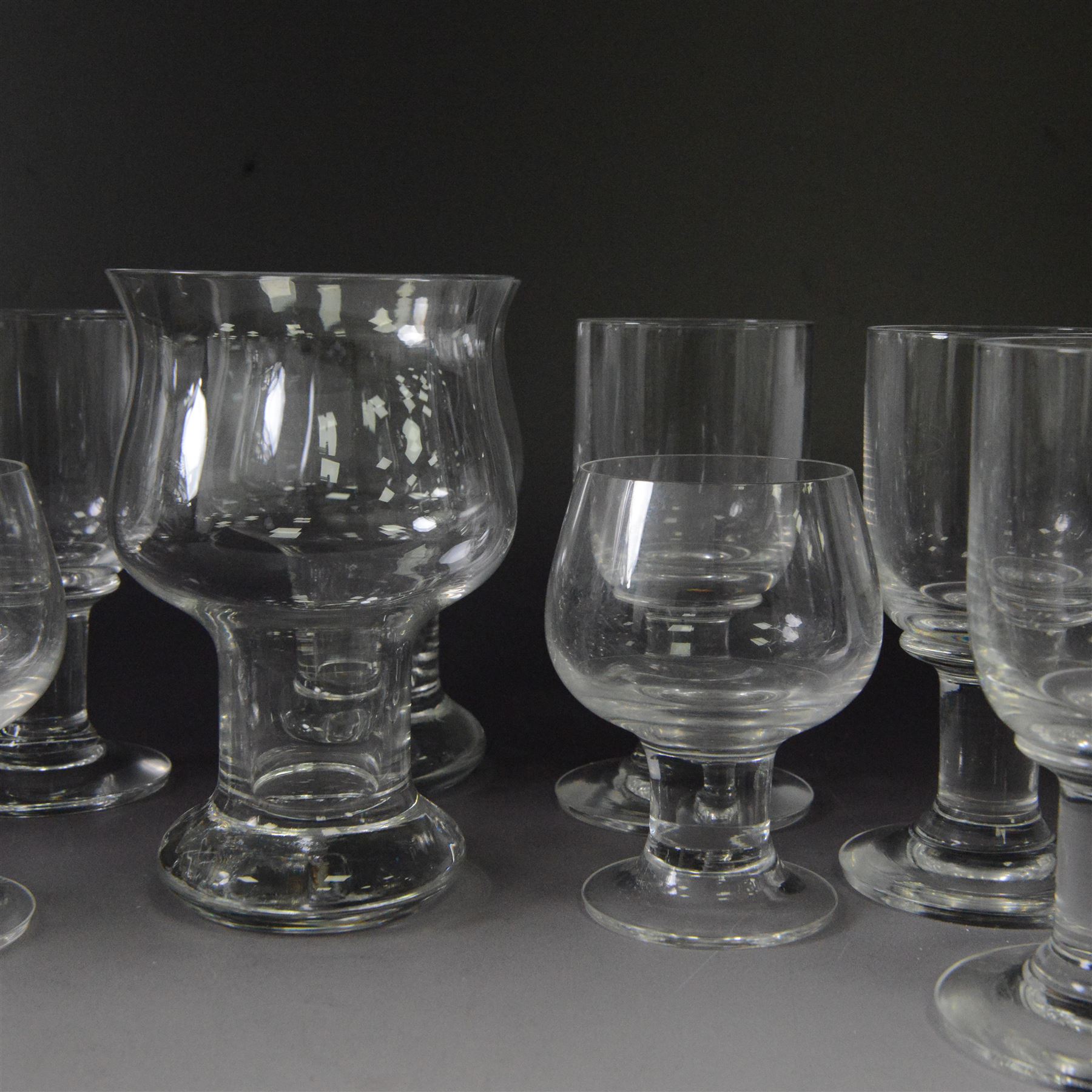 Dartington Crystal pieces designed by Frank Thrower, including claret glasses, Vin decanter, ale glasses and brandy glasses