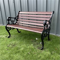 Black painted cast iron and wood slated garden bench decorated with lion heads  - THIS LOT IS TO BE COLLECTED BY APPOINTMENT FROM DUGGLEBY STORAGE, GREAT HILL, EASTFIELD, SCARBOROUGH, YO11 3TX