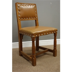  Pair Yorkshire oak dining chairs carved with Yorkshire Rose motif, upholstered in tan leather with stud detail  