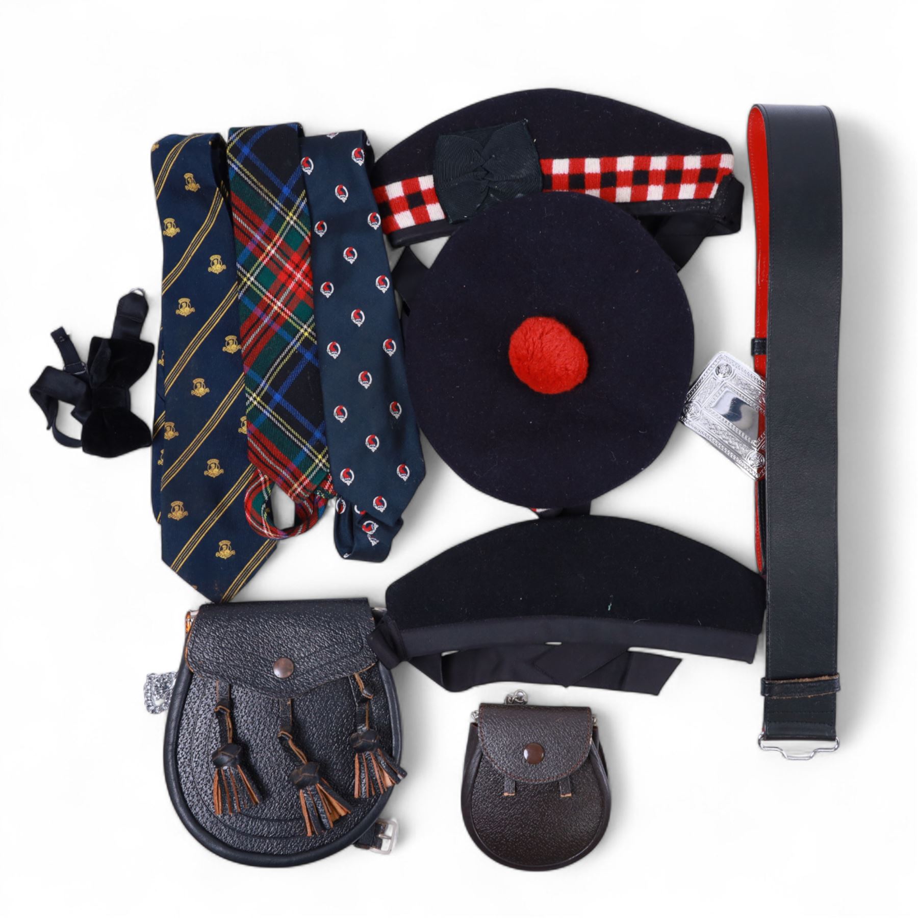 Piping regalia, comprising Armstrong tartan kilt with two kilt pins, three sporrans, including fur example, two jackets, Glengarry hat, other hats, collection of shirts, socks, ties, Hecsan shoes, dirk and belt