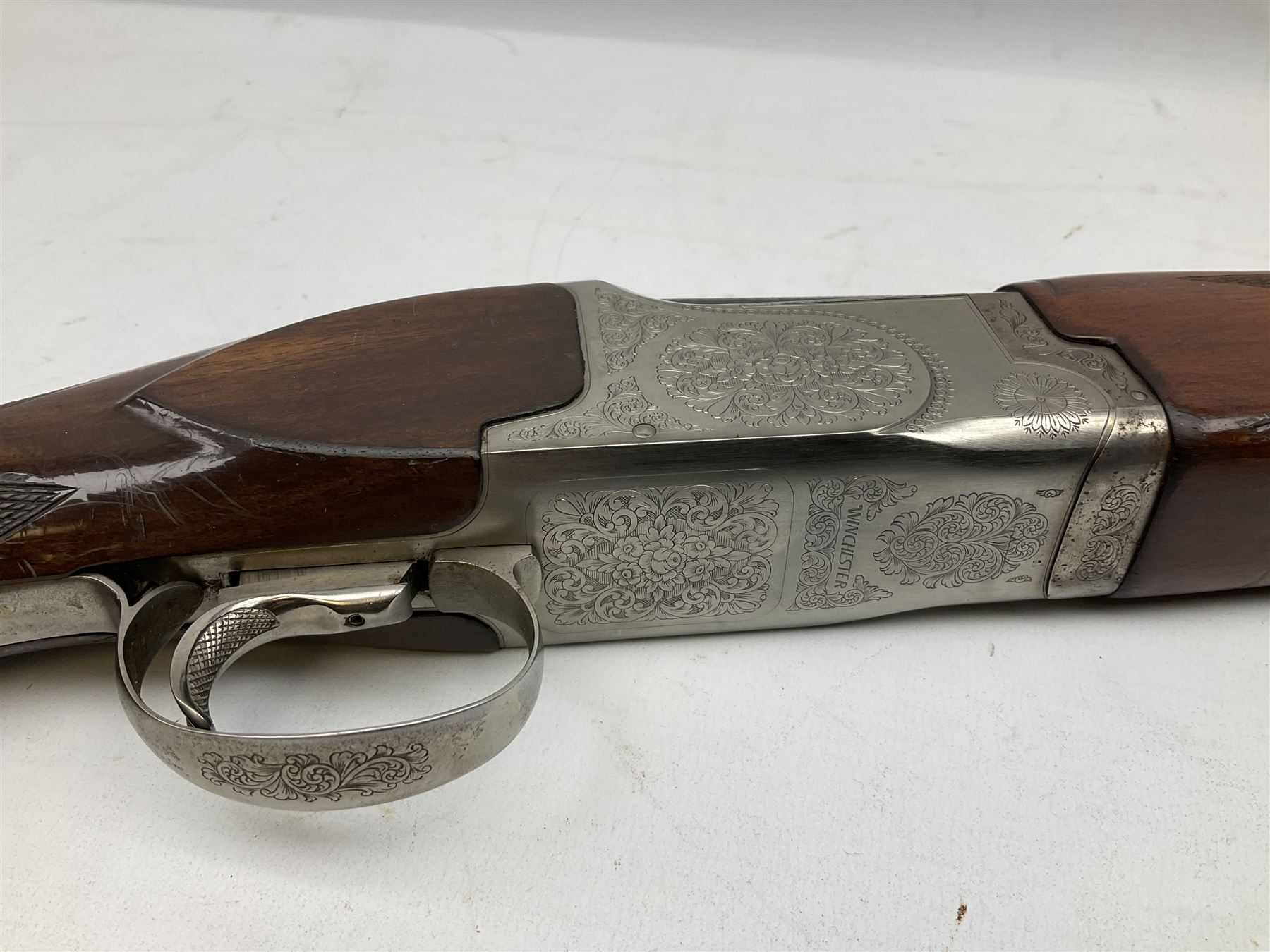 Winchester Japan 5500 12-bore by two-and-three quarters over-and-under double barrel boxlock ejector sporting gun, with 71cm barrels, ventilated rib and barrels, the walnut stock with chequered pistol grip and fore-end, single selective trigger and top safety, serial no.K542927E, L115cm overall; in gun sling SHOTGUN CERTIFICATE REQUIRED