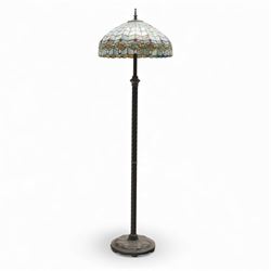 Late 20th century Tiffany style standard lamp, the leaded glass domed shade composed of ge...