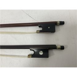 Two wooden violin bows