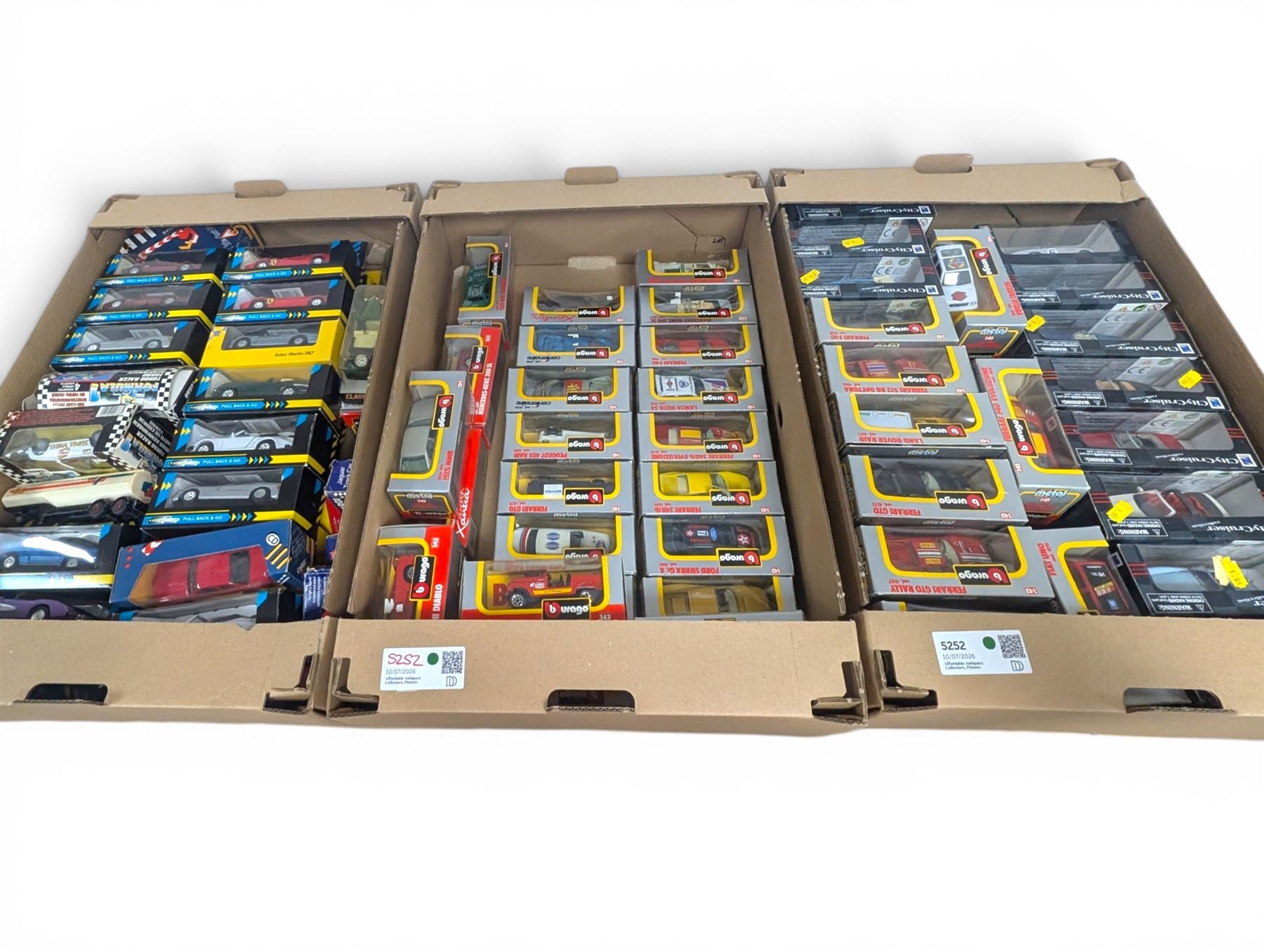 Collection of 1:43 scale diecast model vehicles, mostly Bburago, all boxed, in three boxes