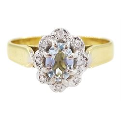 18ct gold oval cut aquamarine and round brilliant cut diamond cluster ring, London 1972
