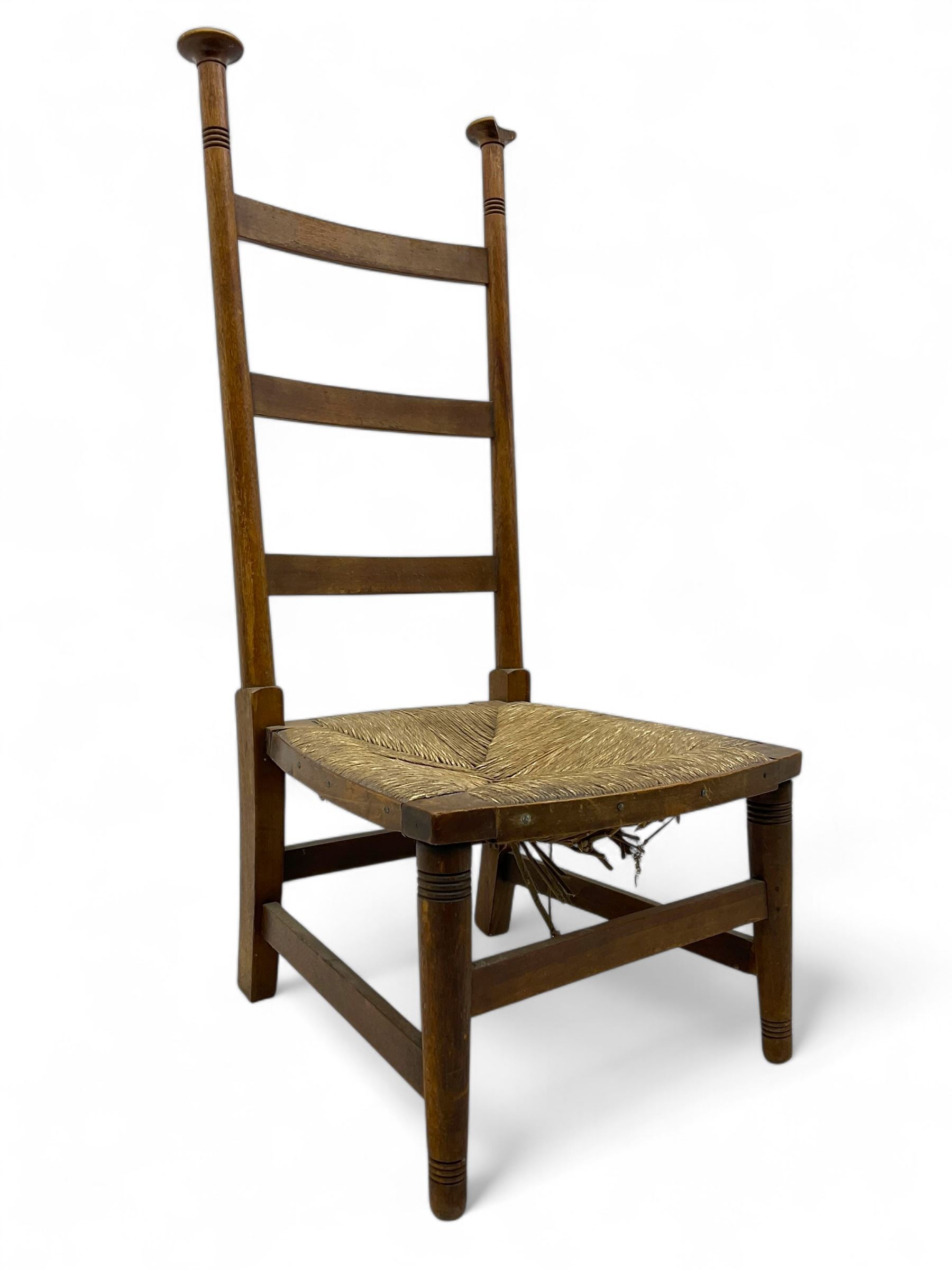 Attributed to William Birch of High Wycombe - Arts & Crafts oak ladder-back side chair, with turned finials, rush seat, and stretchers, raised on square-section supports; 19th century mahogany Pembroke table, rectangular drop-leaf top raised on turned supports with central stretcher and splayed feet