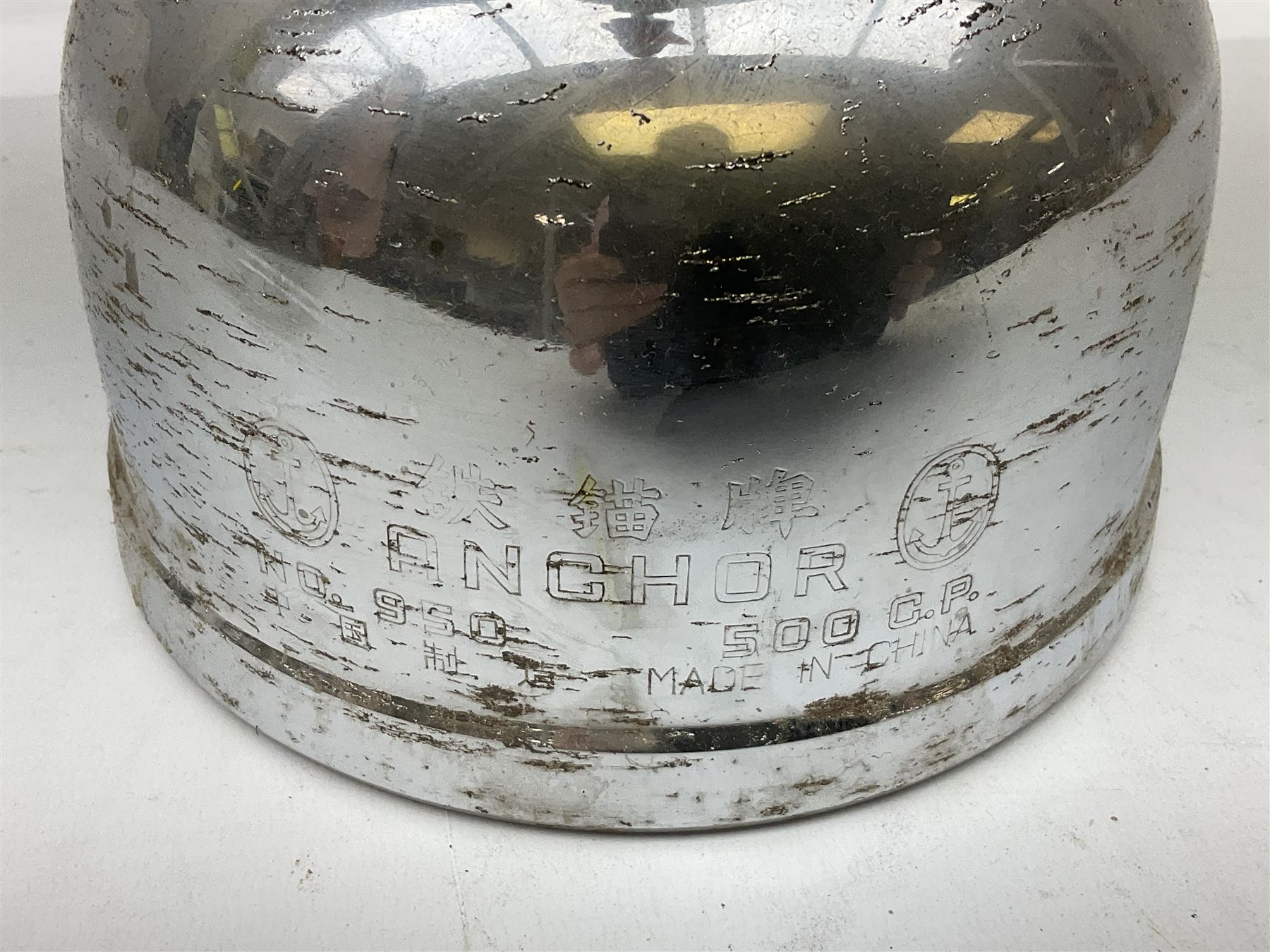 Copper and brass ship’s lamp marked ‘Anchor’, H25cm, Feuer hand storm lantern, Bialaddin Model 315 paraffin lamp and an Anchor lamp (4)