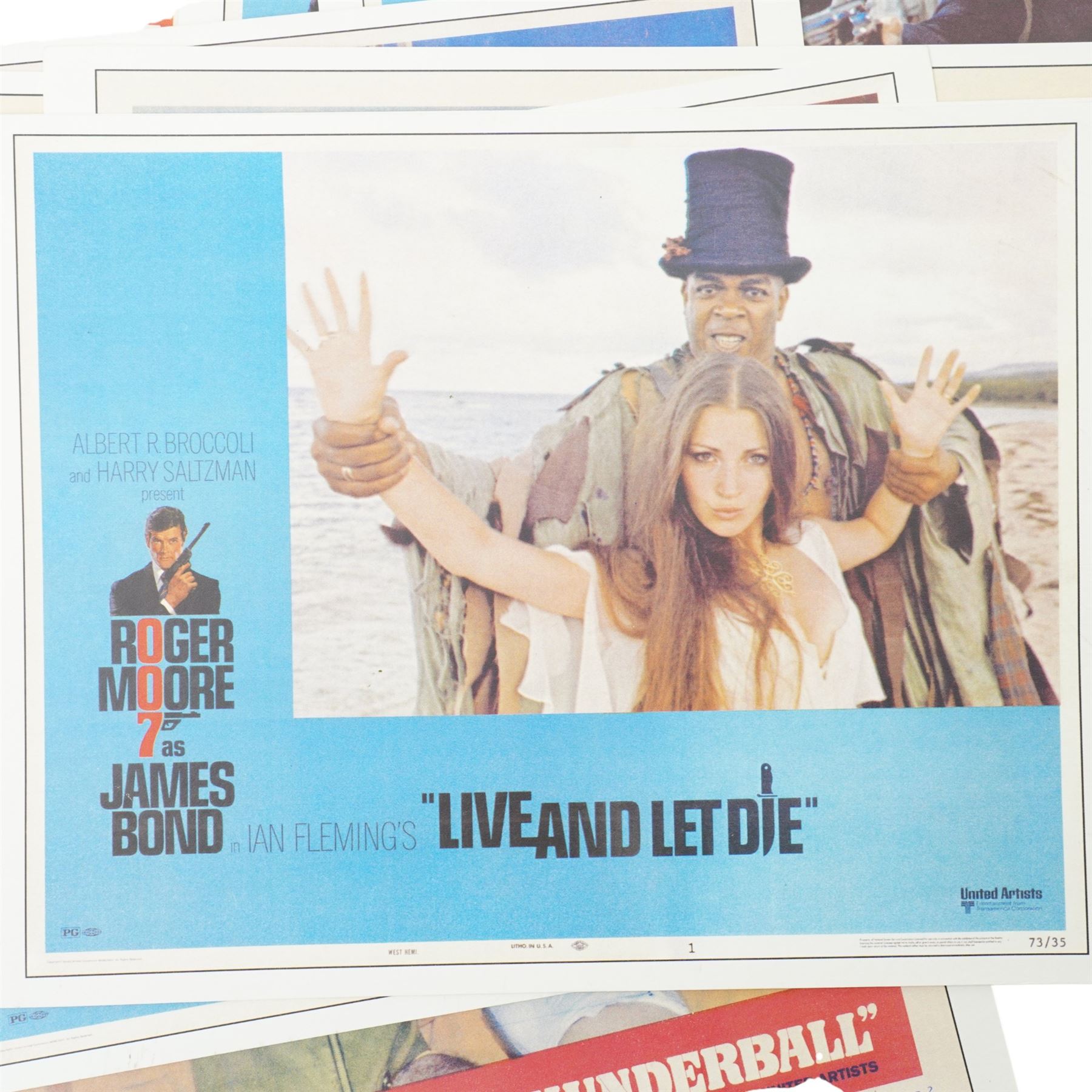  Collection of seventeen James Bond lobby cards starring Sean Connery and Roger Moore including Thunderball, You only Live Twice, Live and Let Die, From Russia with Love etc each 21cm x 27.5cm 