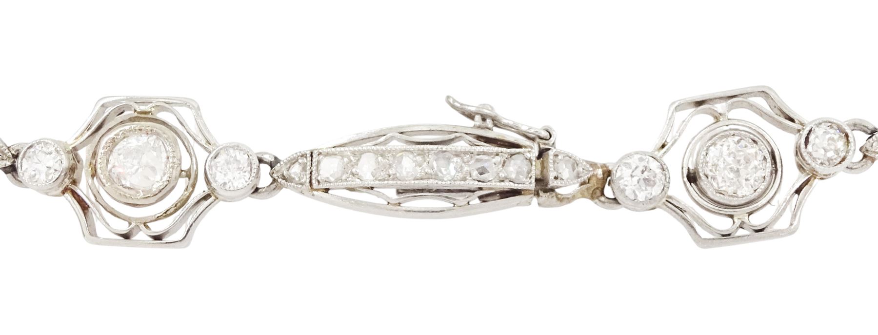 Art Deco French platinum diamond bracelet, six pierced design navette shaped links, set with rose cut diamonds, each spaced by three old cut diamonds, milgrain set in a pierced fancy hexagonal setting, dogs head hallmark, total diamond weight approx 2.00 carat