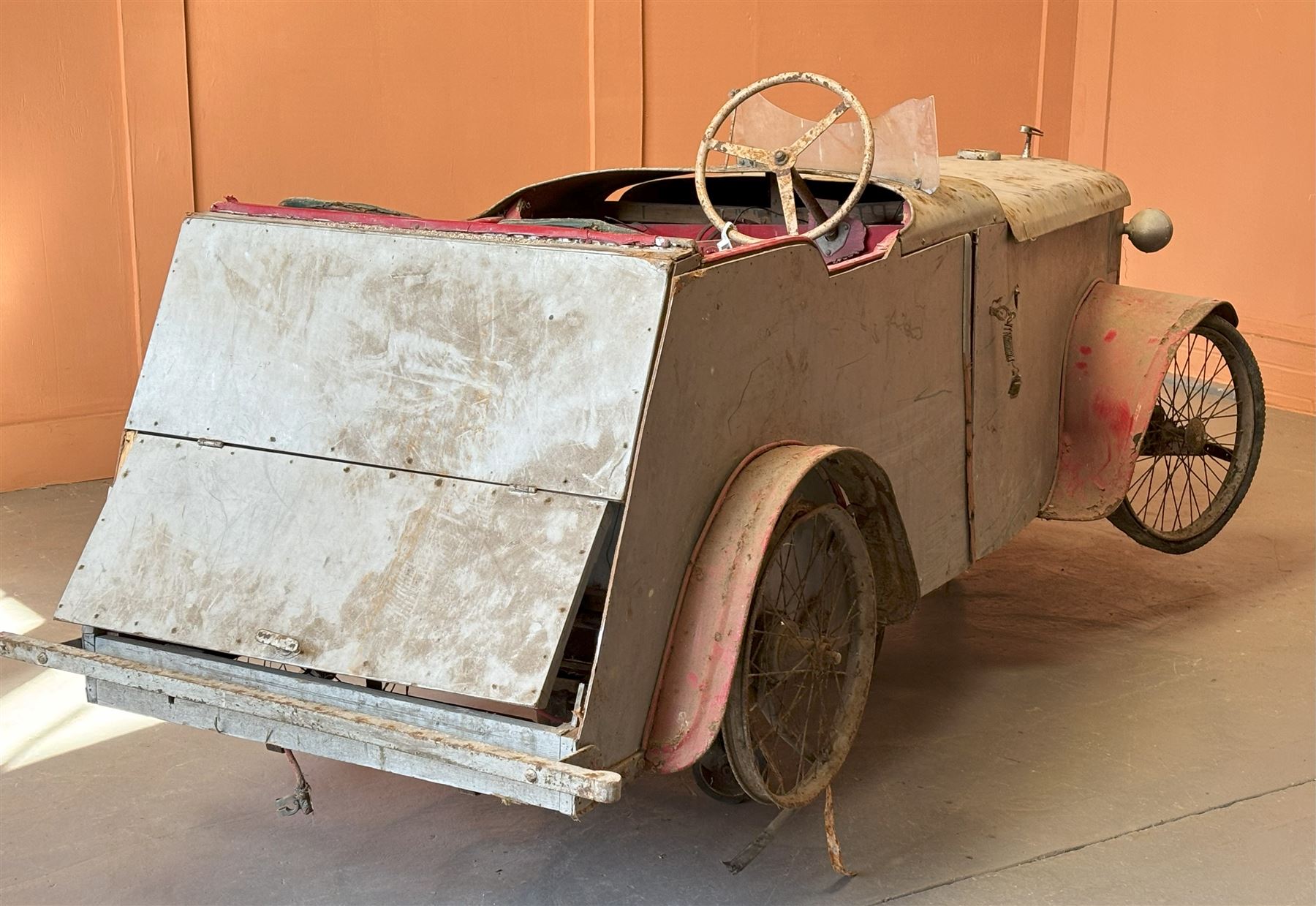 1930's open top two seater electric cycle sports car, in barn find condition, powered by 12v batteries and an electric motor. N.B. There is photographic evidnce to suggest this car was previosuly road registered with 'DMT8' liscence plate. L270cm, W100cm.  - COLLECTION BY APPOINTMENT FROM: The White House, Thirsk Road, Easingwold, York, YO61 3NF - CALL 01723 507111 TO ARRANGE