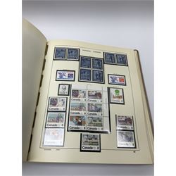 Collection of mostly mint Canadian stamps from 1952 onwards, including some higher values, housed in a 'Schaubek Briefmarken Album Nr944 Kanada' 