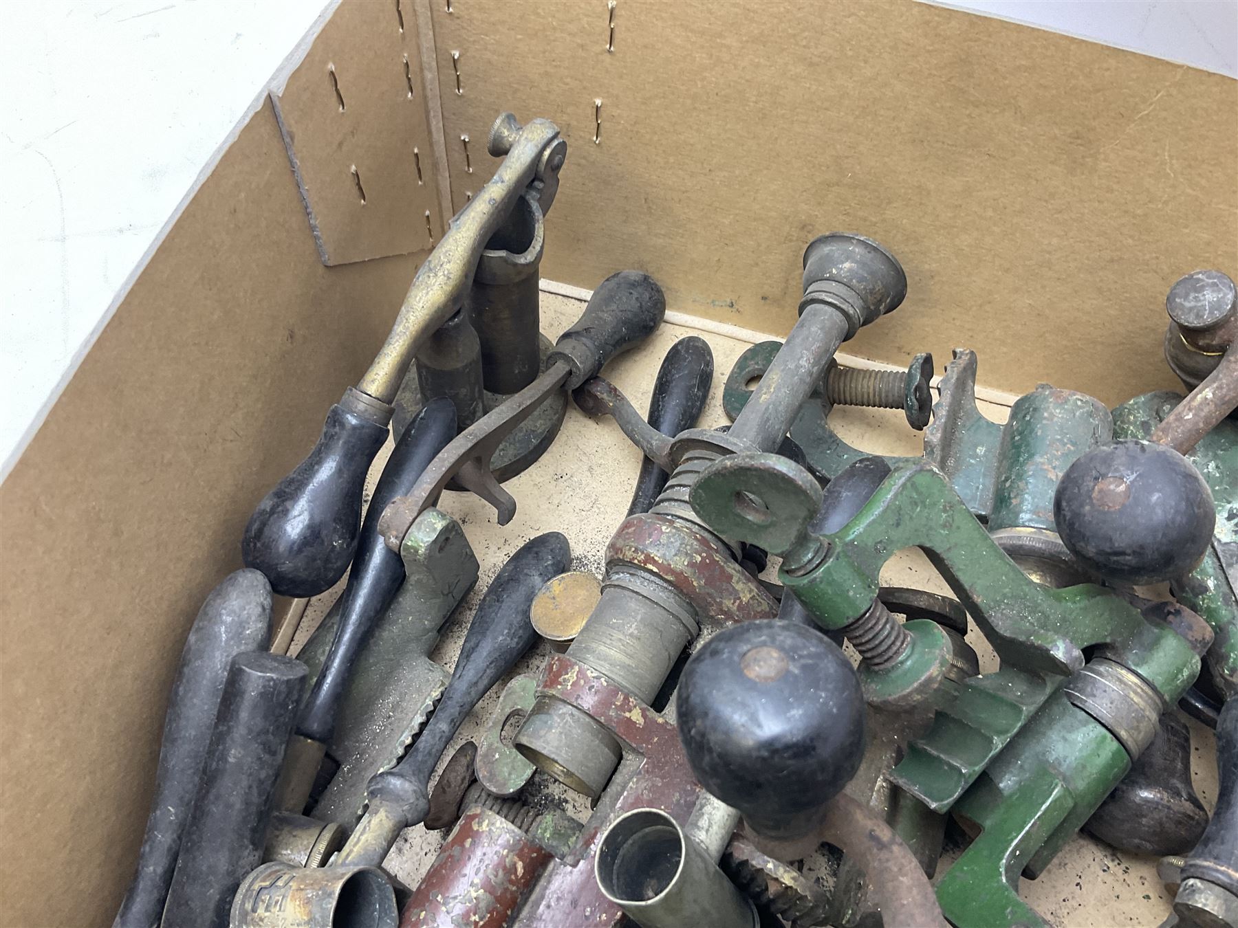 Over twenty items of shotgun cartridge making equipment including eight roll turnover tools, four re/decapping tools, six powder measures etc