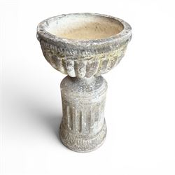 20th century good quality weathered cast stone pedestal urn of ecclesiastical design, circular lobed bowl with rope twist and lattice border, raised on squat base with fluted column  and acanthus decorated base