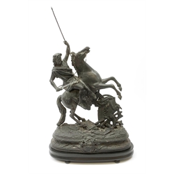 After Theodore Doriot, 19th century spelter figure of a barbarian warrior with spear and sword on a rearing horse, with battle trophies on the naturalistic base, H64cm including later ebonised wooden base