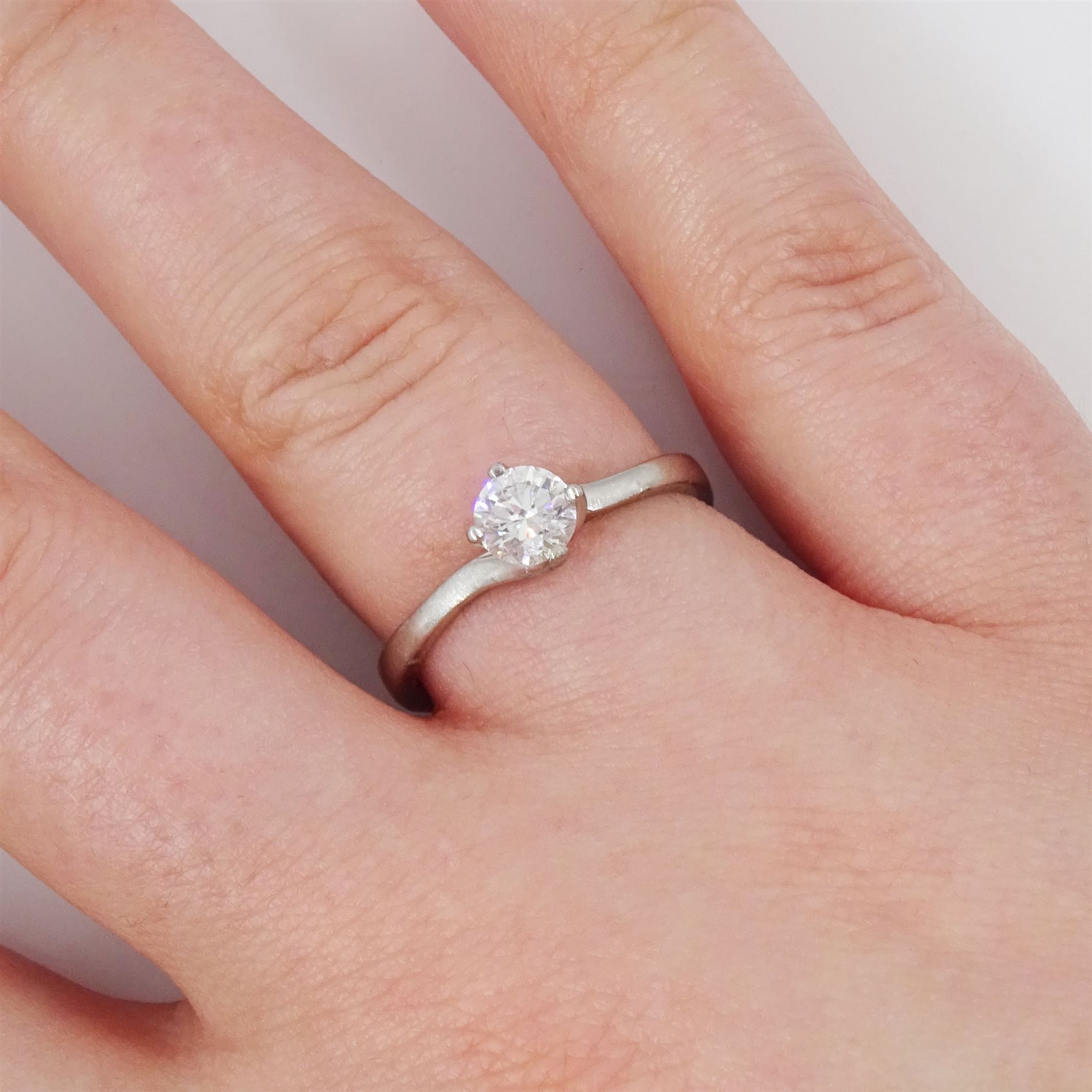 Platinum diamond ring, four claw set with a single round brilliant cut diamond of approx 0.50 carat, hallmarked