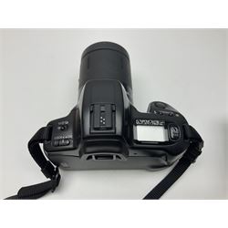 Four Minolta camera bodies, to include Dynax 500si, serial no. 94812651 with 'Signa Zoom 1;3.5-4.5 f=28-70mm' lens, Maxxum 300si, serial no. 97821665, with 'Tamron AF 80-210mm' lens and Dynax 300si, serial no 01603265'  with Minolta AF Power Zoom 35-80mm 1;4' lens, etc, together with Pantax MV1 camera bodies and other camera equipment 