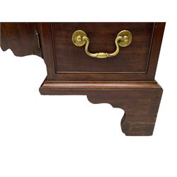 George III mahogany kneehole desk, moulded rectangular top over one long drawer and six smaller drawers, the recessed cupboard with shaped apron enclosed by rectangular door, on bracket feet