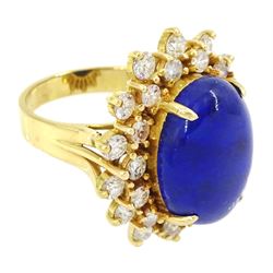 18ct gold lapis lazuli and diamond cluster ring, single oval cut lapis lazuli with two rows of round brilliant cut diamonds, stamped 750, total diamond weight approx 1.70 carat