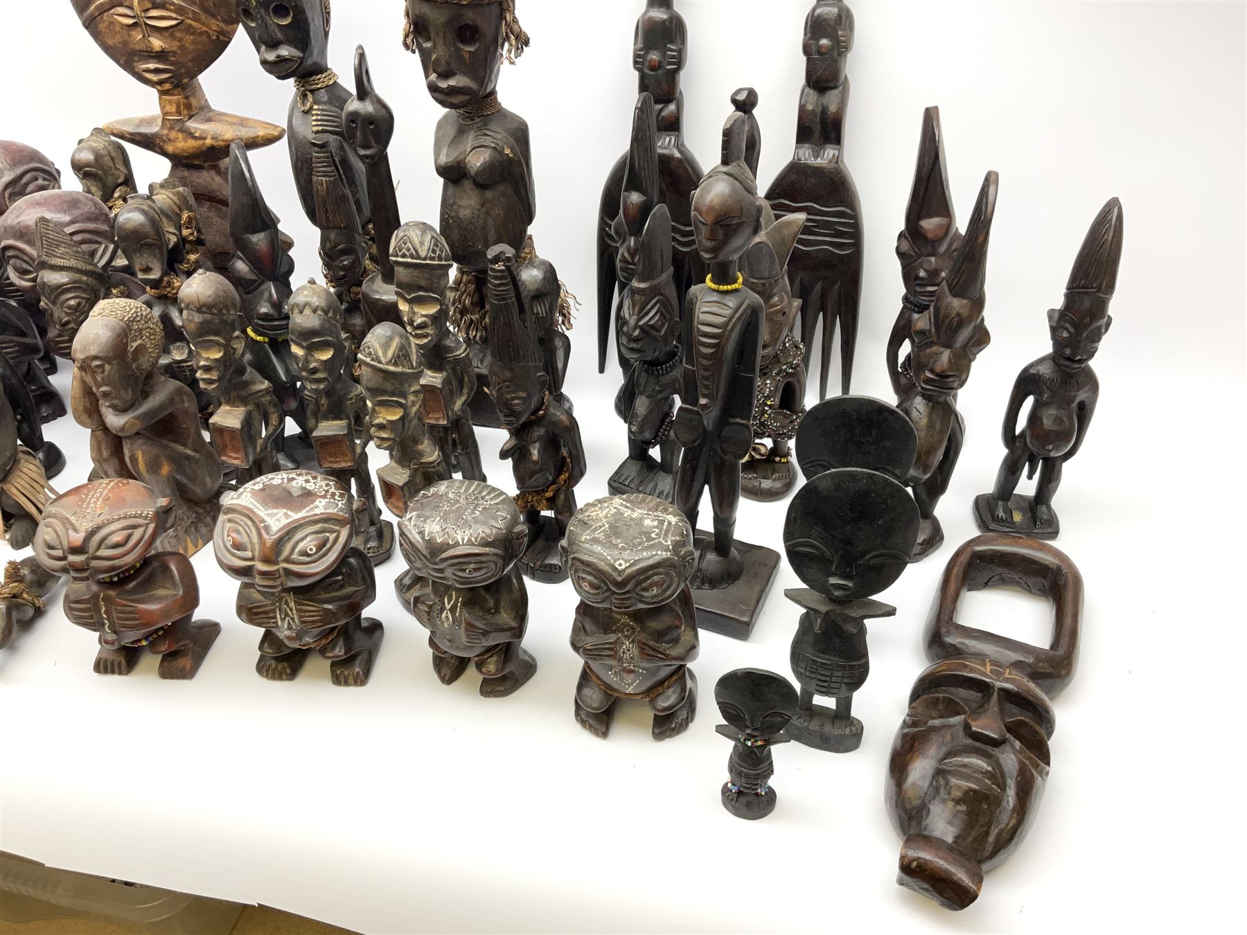African carved wood figures, various forms and sizes including some with rope decoration, in two boxes