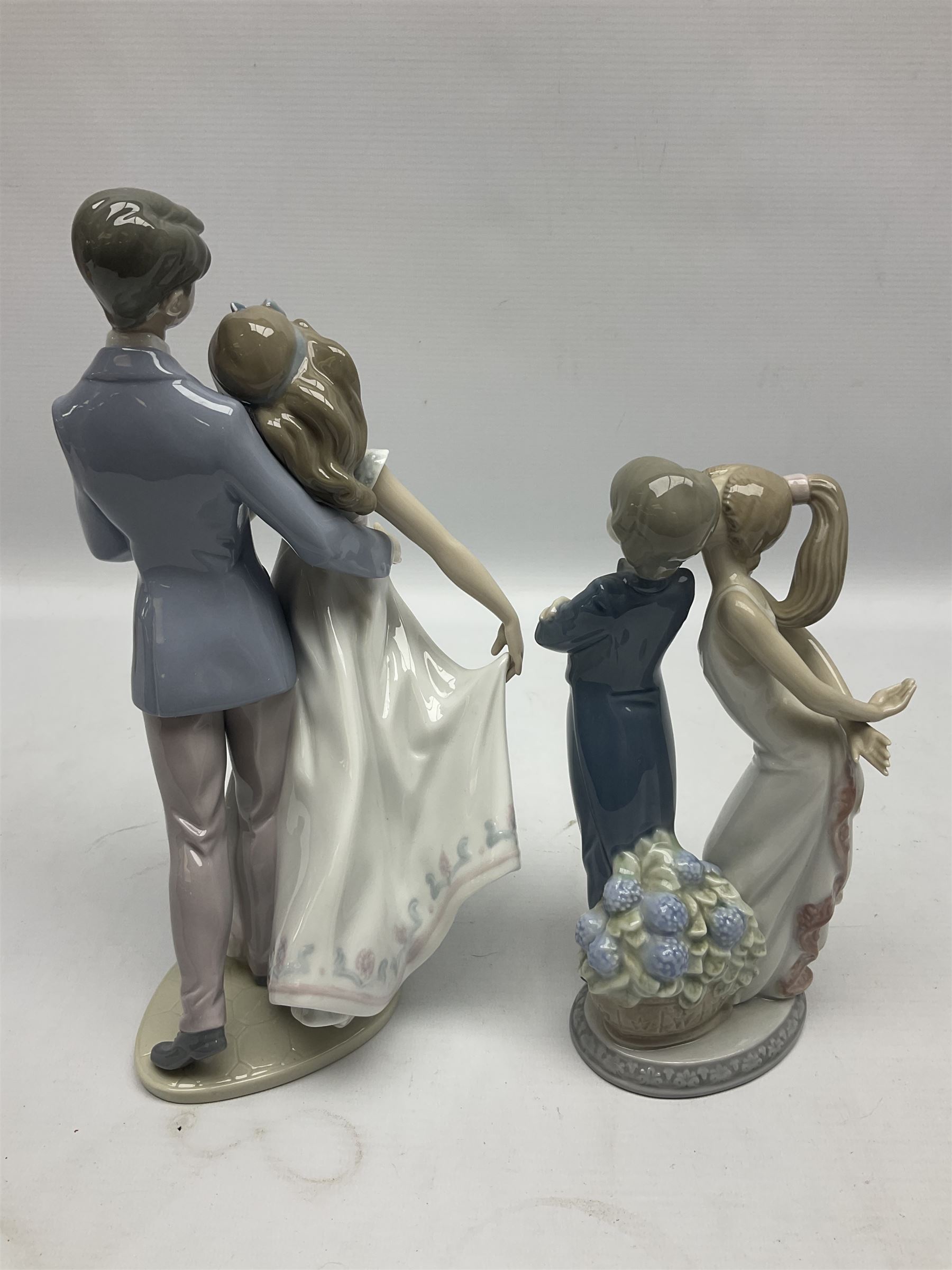 Two Lladro figures, comprising Now & Forever no 7642 and Kiss & Make Up no 5555, largest example H28cm