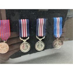 Limited edition large framed display board with sixty half-size copies of British Gallantry and Campaign Medals produced by Danbury Mint; all with ribbons and associated booklet