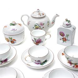18th century Berlin part tea and coffee service circa 1780 painted with sprays of Spring flowers comprising four tea cups, five coffee cups,  six saucers, tea pot, tea caddy and sucrier and cover  
