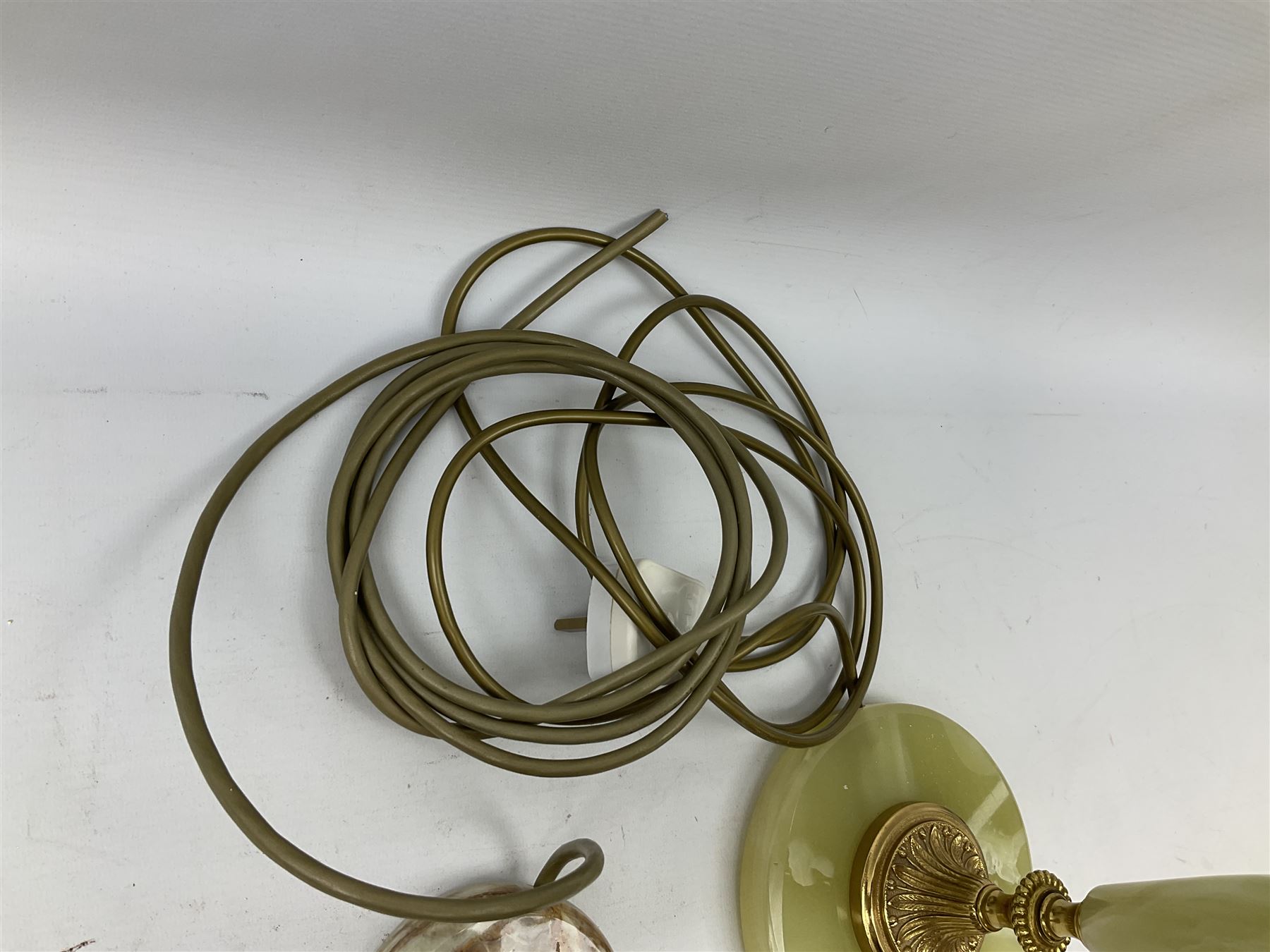  20th century gilt metal and onyx four branched candelabra upon a circular base, and onyx table lamp in the form of an urn, tallest example H48cm