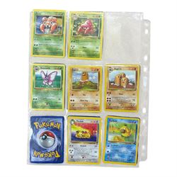 Collection of mainly vintage Pokemon cards including Charizard Base Set Holographic number 4/102 and two Ancient Mew 2000 promo cards, some housed within plastic wallets and some loose
