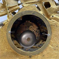 French - late 19th century 8-day gilt spelter mantle clock retailed by J Vassalli of Scarborough c1890, sculptured with an oriental 16th century representation a Mughal warrior slaying a leopard, raised on a profusely  decorated base with scroll work and splayed feet, white enamel dial with Roman numerals, minute track and steel hands, Parisian twin train countwheel striking movement, striking the hours and half-hours on a bell. With pendulum & Key.  