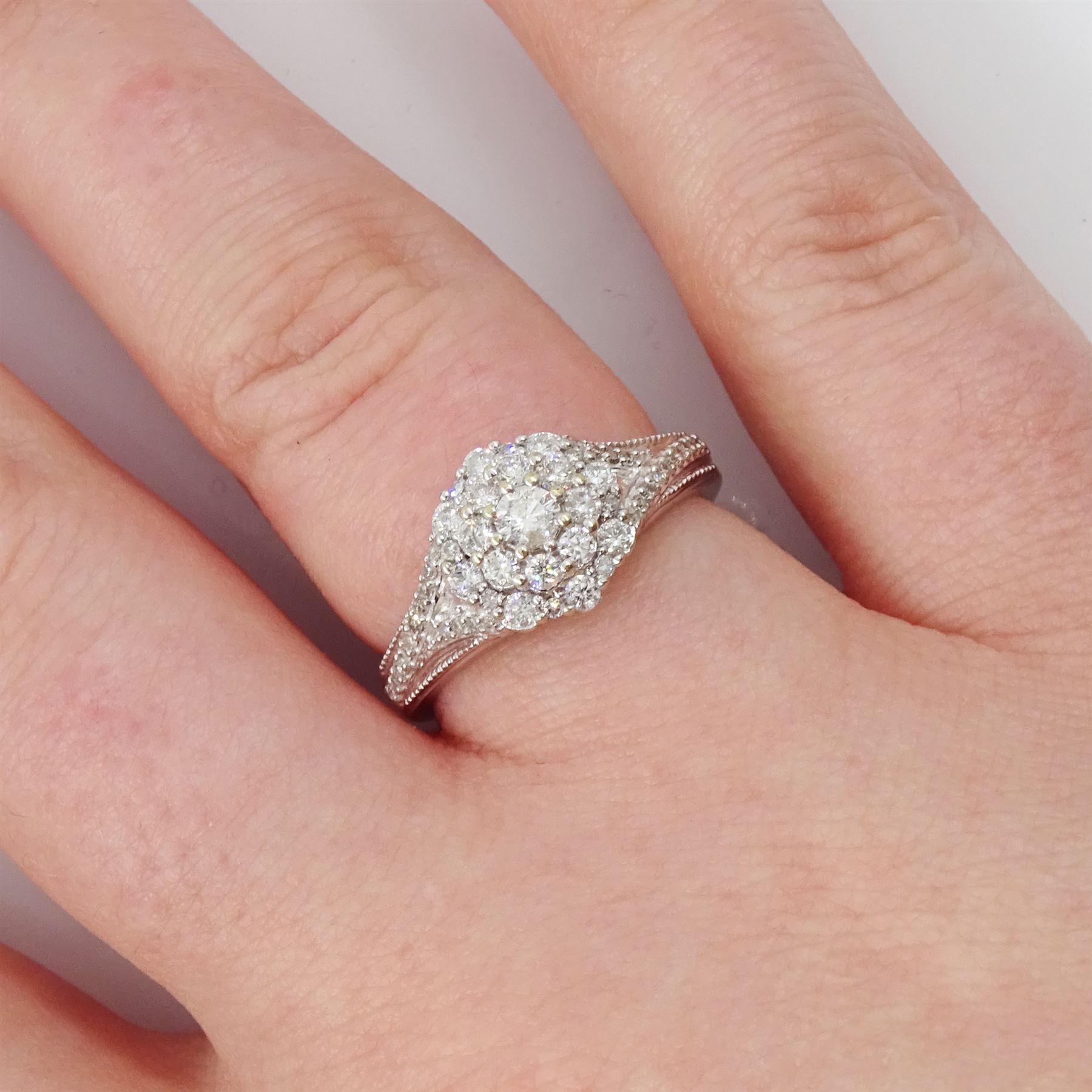 9ct gold diamond cluster ring, set with round brilliant cut diamonds and diamond set shoulders, hallmarked, total diamond weight 0.50 carat