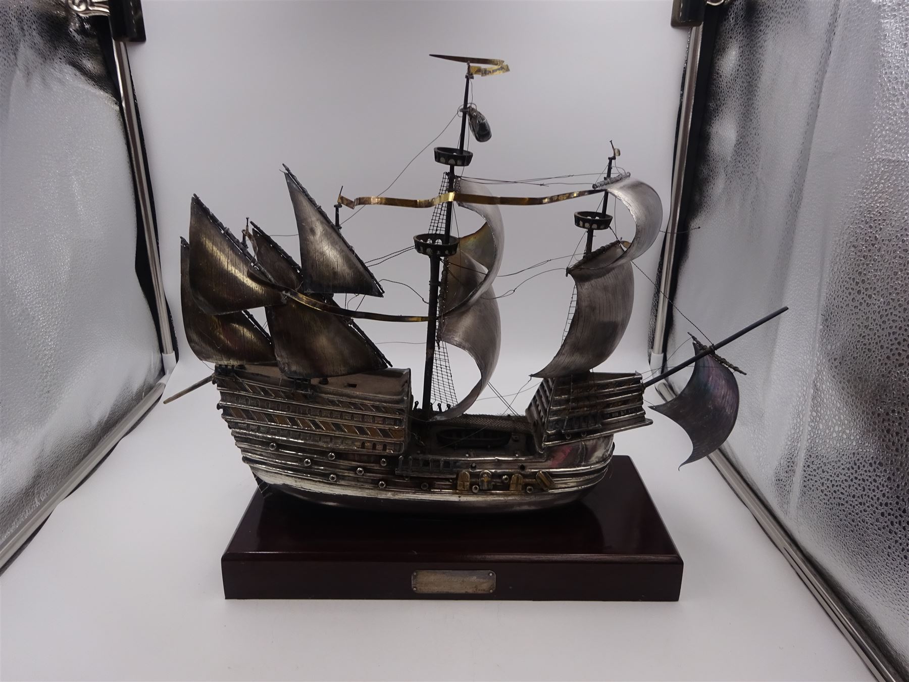 Modern silver limited edition model of The Mary Rose, depicting the ship in full sail, with gilded details, hallmarked Ammonite Ltd, Birmingham 1982, model height 32cm, mounted upon rectangular wooden plinth with applied silver name plaque, no. 9/250, overall H36.5cm