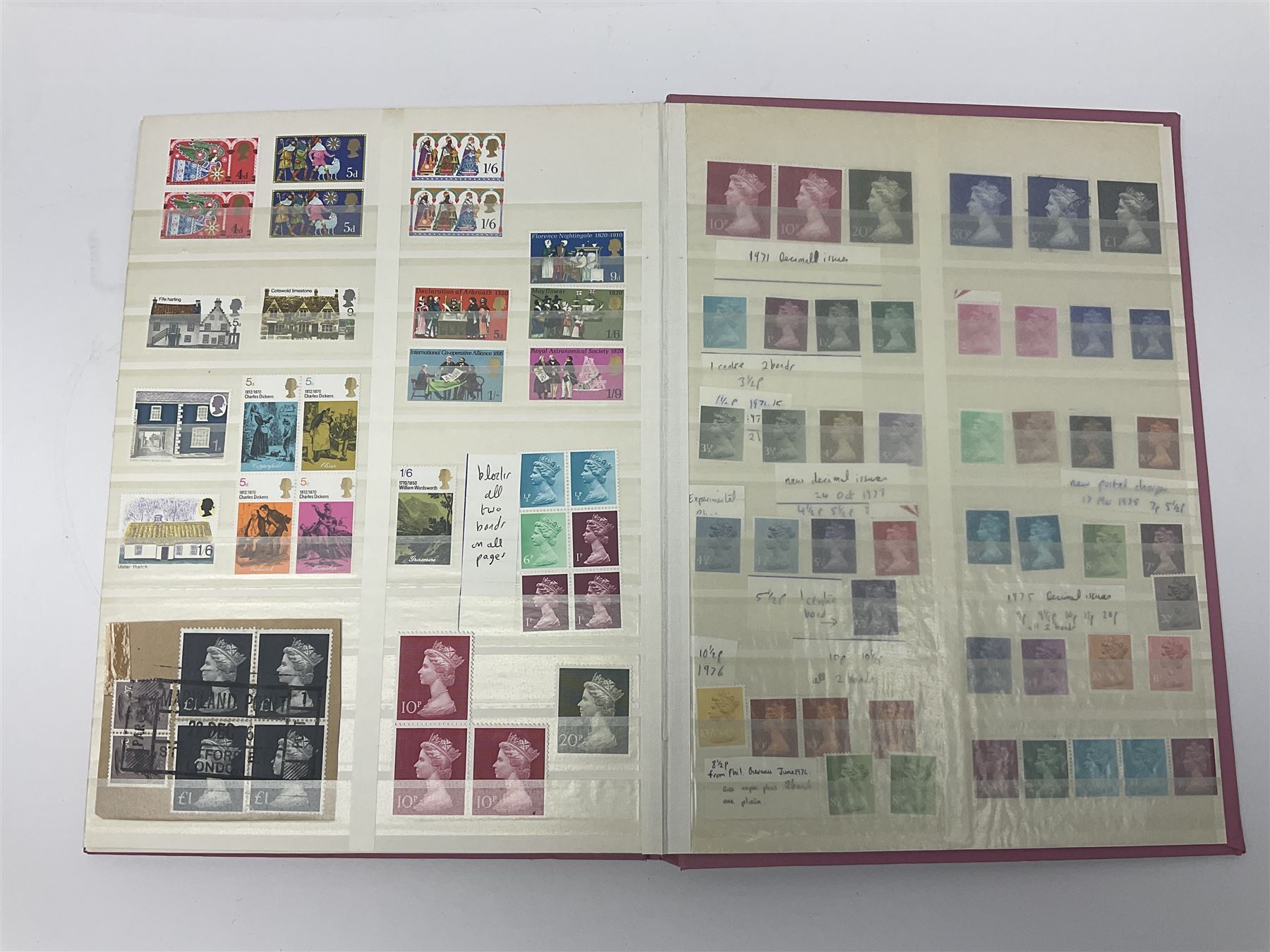 Mostly Great British stamps, including King Edward VII two shillings and sixpence, five shillings and ten shillings, King George V seahorses, King George VI high values, Queen Elizabeth II pre and post decimal etc, housed in a pink stockbook 