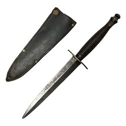 Fairburn and Sykes Commando fighting knife, 3rd pattern with 17cm double edged blade and copperised grip; no markings; in cut-down plain leather sheath L31.5cm