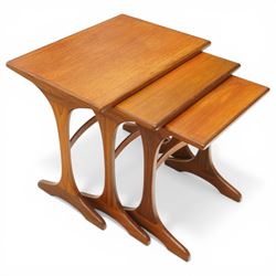 Victor Wilkins for G-Plan - 1970s teak 'Fresco' nest of three tables, rectangular top over vasiform end-supports with sledge feet, united by curved stretchers