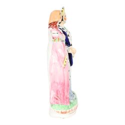 Rare 19th century Staffordshire pottery figure, modelled as Henry VIII and Anne Boleyn, Henry stood on the right and Anne left holding hands, H24.5cm
