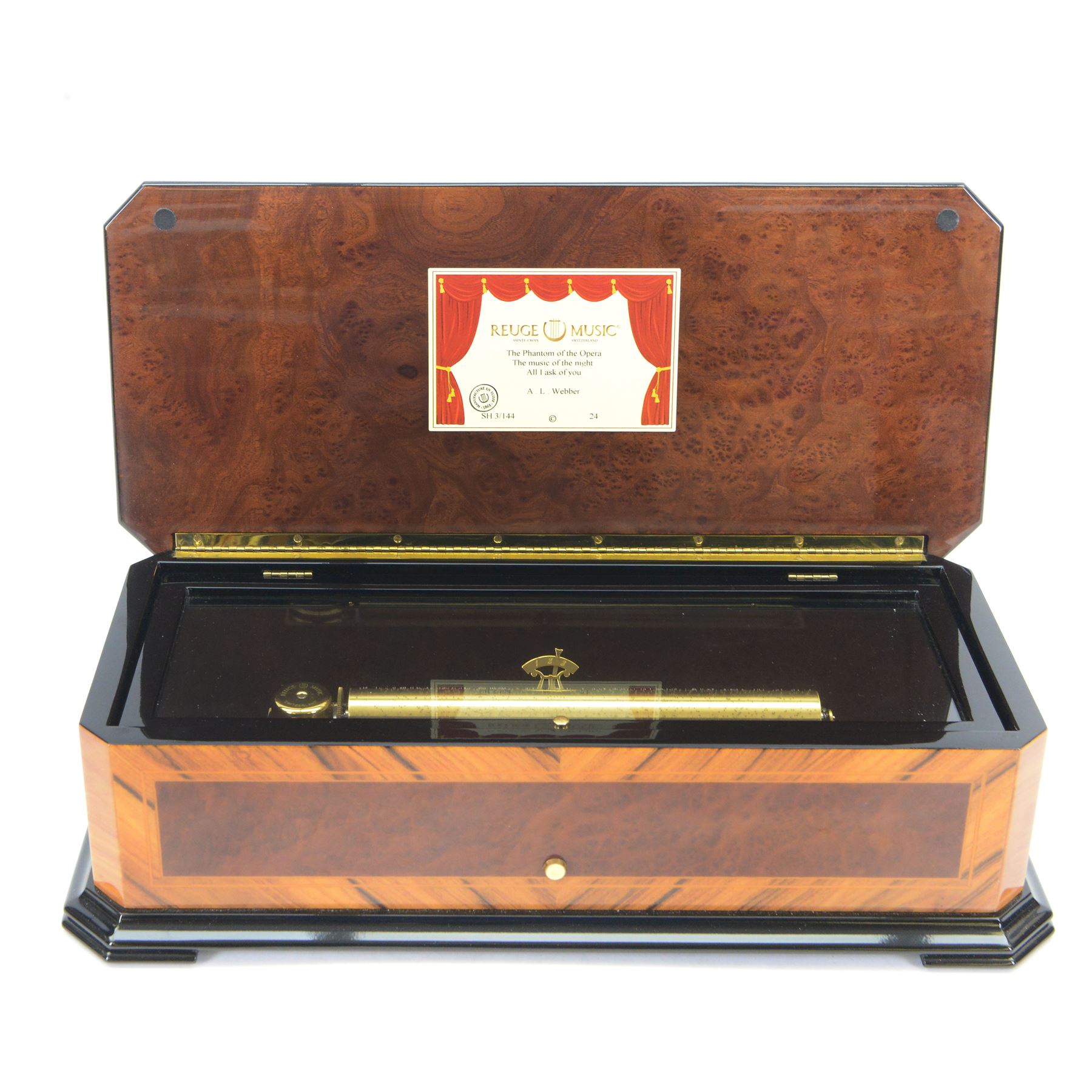 Reuge Sainte-Croix- 21st century Swiss musical box with a highly polished lacquered finish, inlaid and ebonised case with a glazed internal viewing lid, polished steel 144 teeth two-part comb playing three arias from The Phantom of the Opera by Lloyd Webber, with tune indicator and tune sheet.