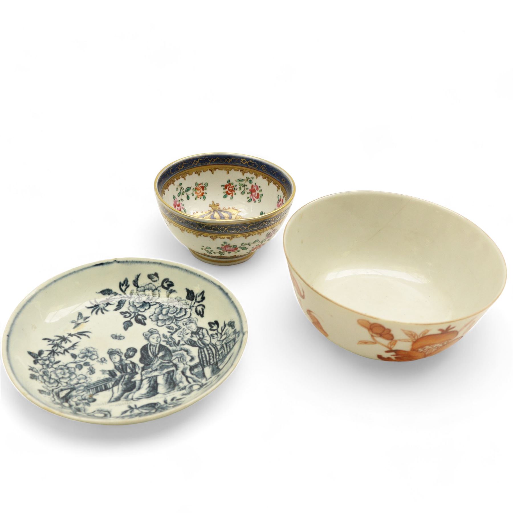 Chinese tea bowl, the enamel decoration depicting floral sprigs within a gilt and blue boarder, with a crowned shield to the centre, together with another bowl and a saucer