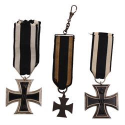  WWI German two Iron Crosses 1st class, together with a Iron Cross watch fob 