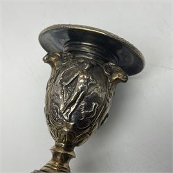 Pair of Victorian Elkington Mason & Co silver plated candlesticks, decorated in relief with ram masks and figures, H14cm