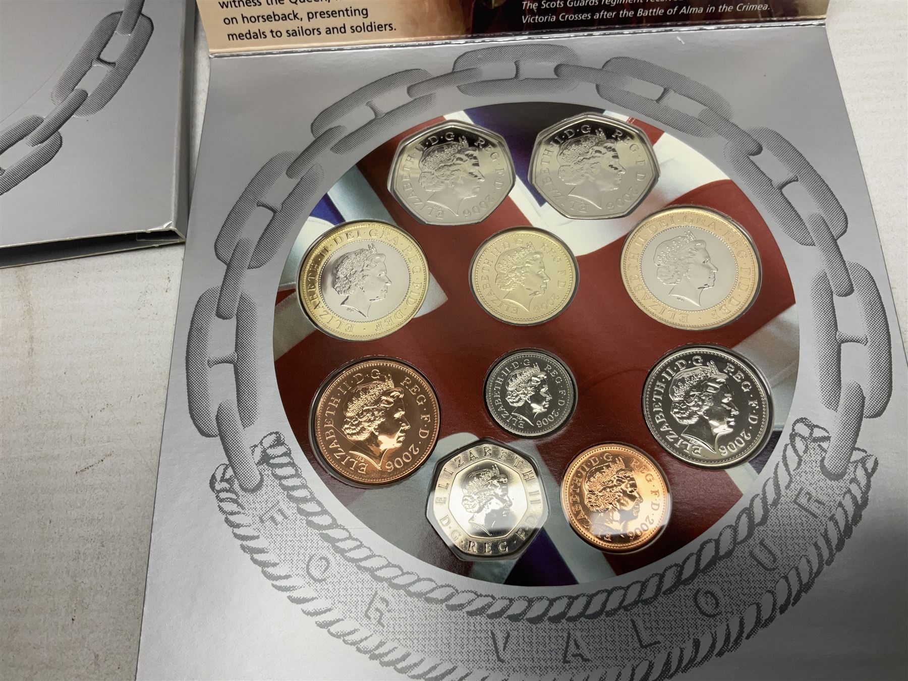 The Royal Mint United Kingdom 2006 brilliant uncirculated coin collection, in card folder and a part set of The London Mint Office 'The Platinum Wedding Anniversary Photographic Collection' coins