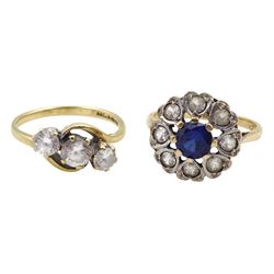 Gold three stone cubic zirconia ring and a gold blue and clear stone set cluster ring, both 9ct