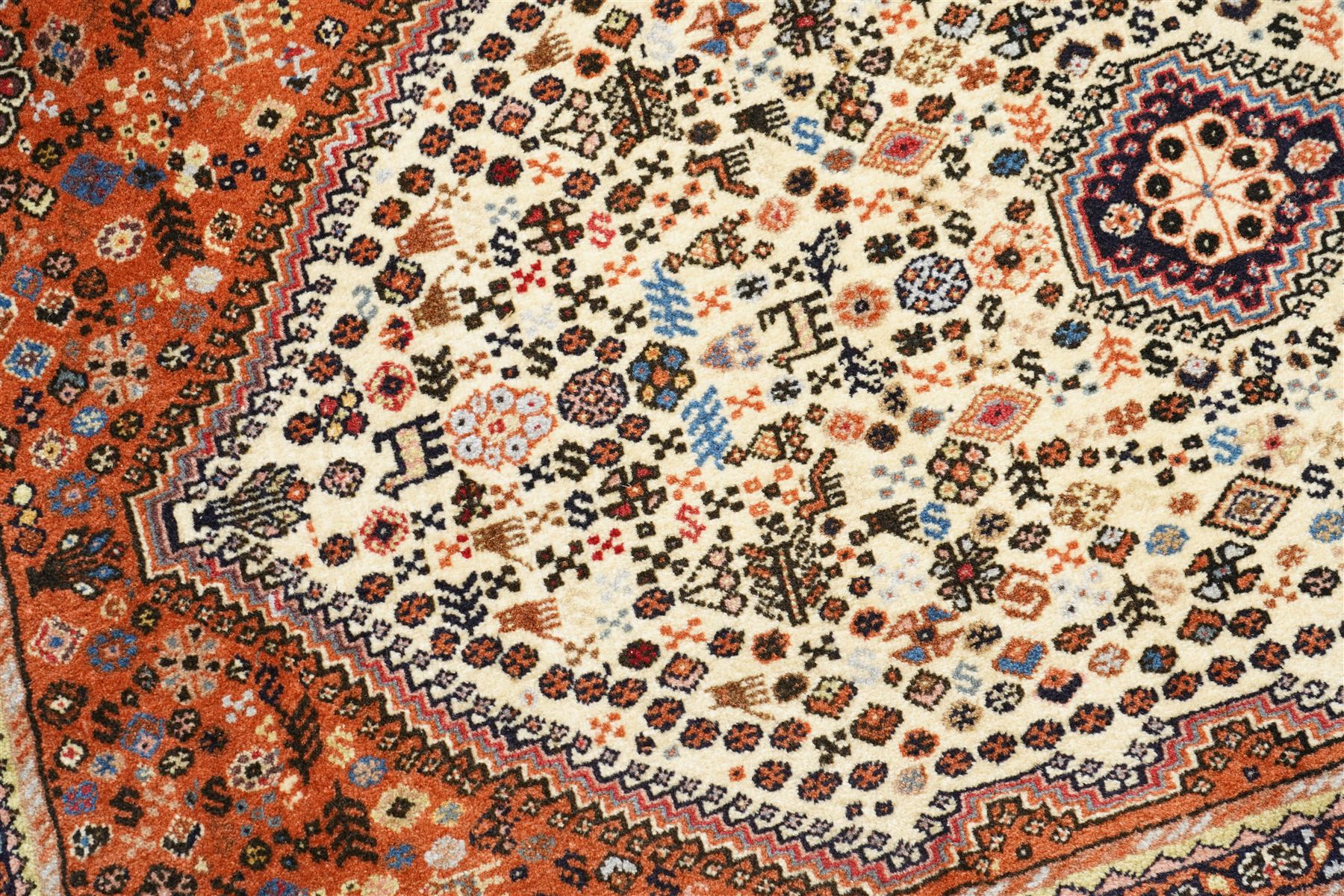 Persian design wool rug, 'Tarange-Lachak' medallion and corner design on a white and pink field framed by pink borders 