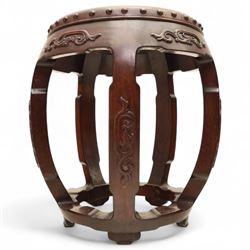 Pair of early 20th century Oriental hardwood barrel seats, of drum form with shaped apron and pierced panels, carved with stylised scrollwork and studded detail to the top