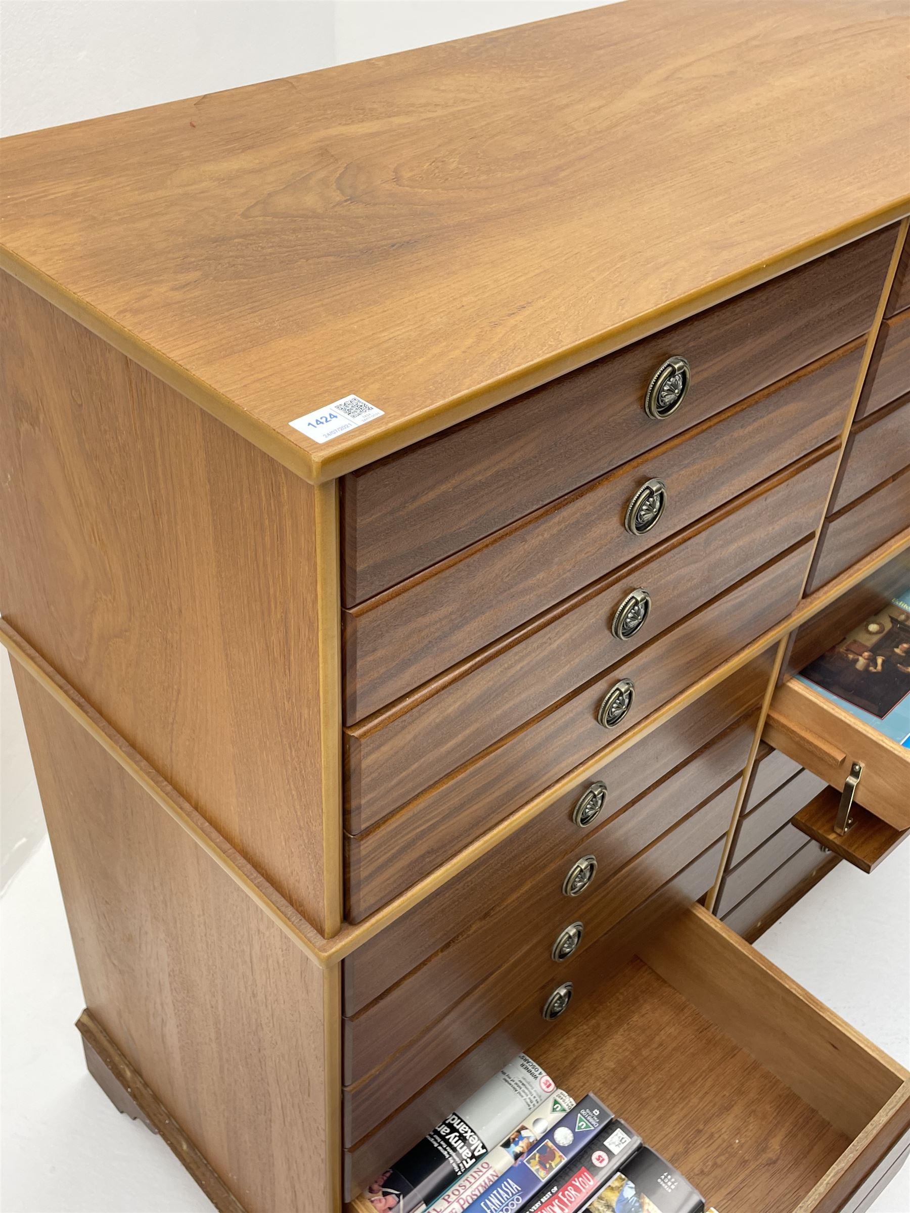 Teak multi-drawer music chest, fitted with eight drawers and four manuscript drawers with fall fronts, with contents