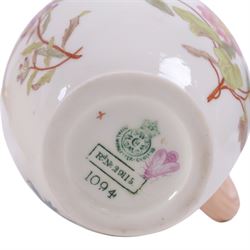 Five Royal Worcester Blush Ivory jugs, comprising one shape 1085 example with bamboo handle, one shape 1376 example with floral decoration and gilt handle and three shape 1094 examples, each decorated with floral sprigs, with printed marks beneath, tallest H14cm